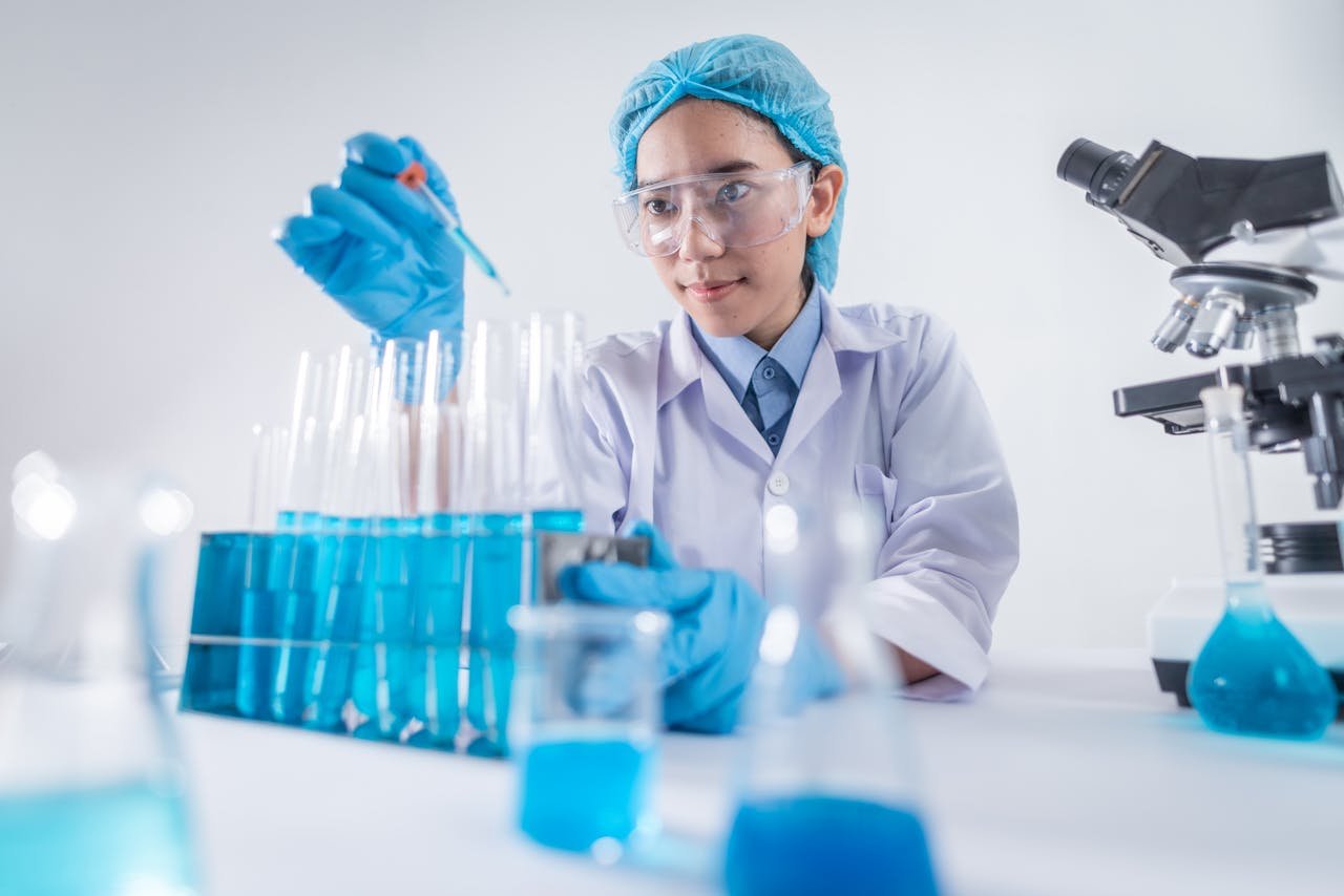 A female scientist using lab equipment for research in a modern laboratory setting.